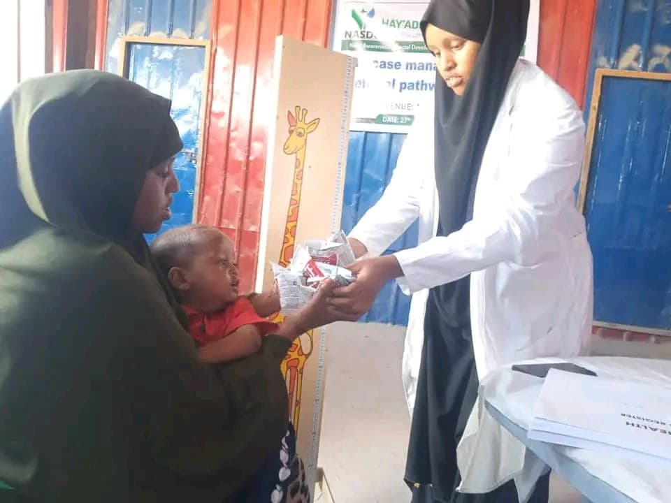 Life-saving RUTF for a child in Moyko Village